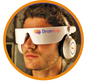 a man using braintap headset which uses unique frequencies of light and sound to produce incomparable brain fitness.