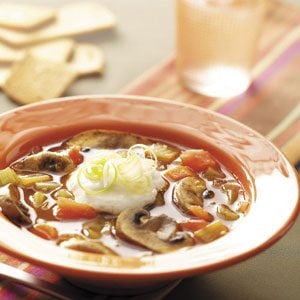 orange plate with mushroom soup