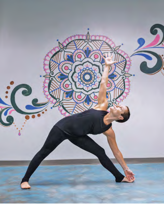 a man performing yoga at Go Yoga! Express